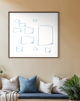 A framed minimalist art print with blue geometric line drawings on a white background, hanging on a beige wall above a blue bench with pillows in a styled interior setting.