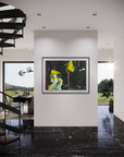 A framed abstract landscape painting featuring vibrant green, yellow, and red brushstrokes on a dark background, displayed on a white wall in a modern interior with black marble flooring and a spiral staircase.