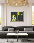 A framed abstract painting with vibrant green, yellow, and black brushstrokes hangs on a beige wall in a modern living room setting above a dark gray sectional sofa.