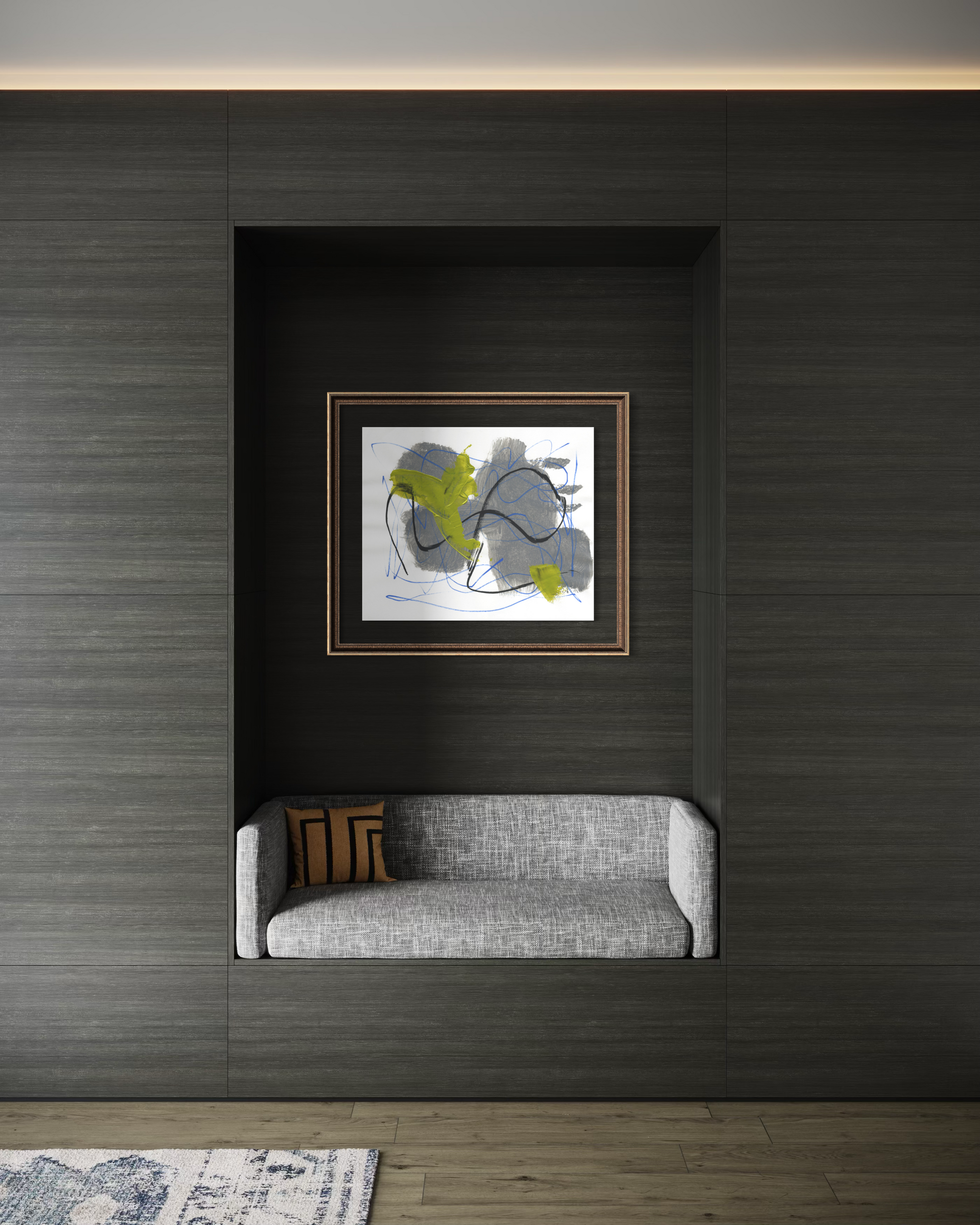 A framed abstract wall art print with gray, white, and lime green brushstrokes, displayed in a recessed niche above a modern gray upholstered bench against a dark wood-paneled wall.