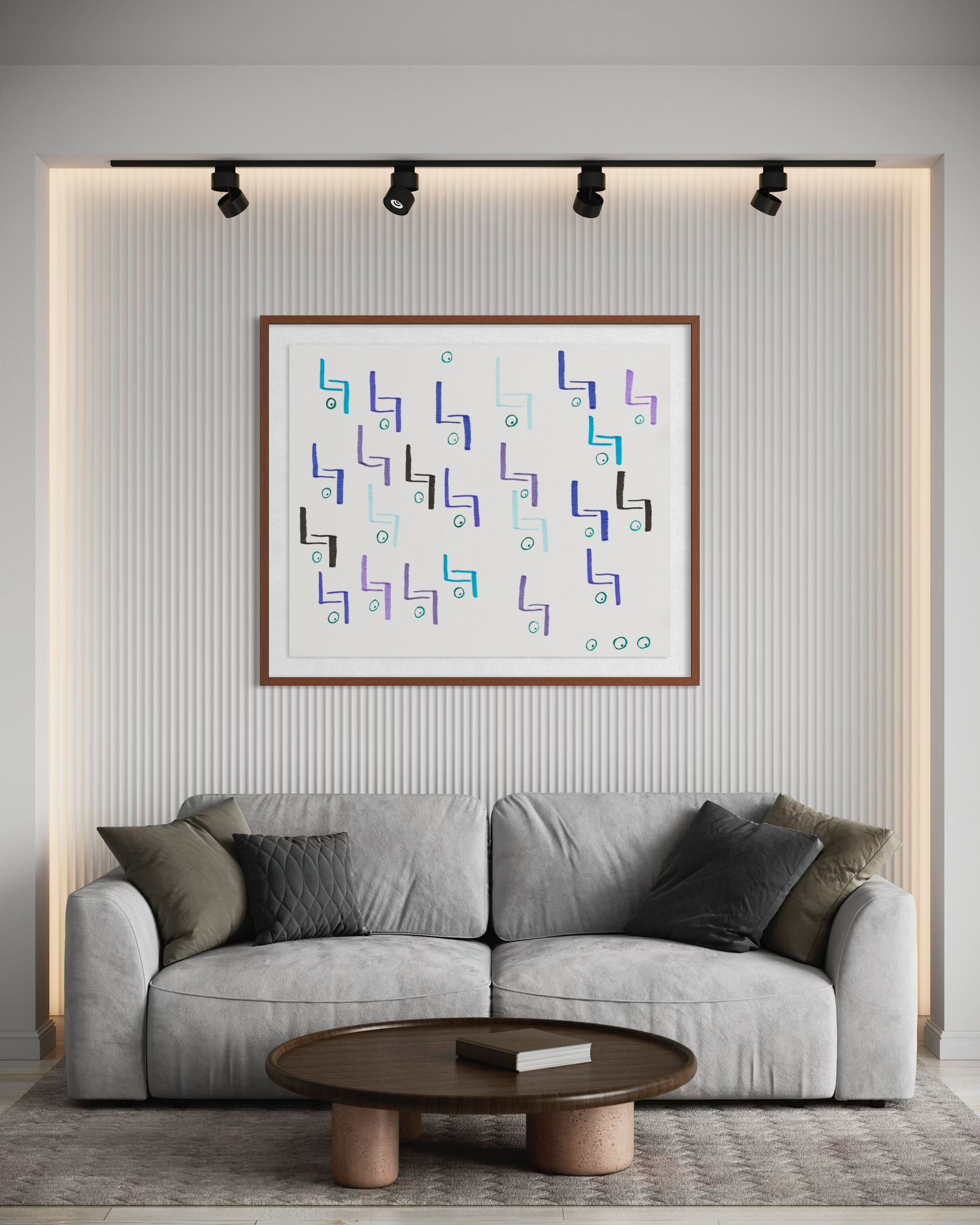 Living room area with off white couch and decorative brown and grey pillows.  Cocktail table set up in front of the sofa and a geometric abstract painting hangs above it 