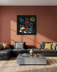 A modern living room with a terracotta accent wall featuring a colorful abstract canvas print. Below the artwork is a dark gray sectional sofa with accent pillows, a marble coffee table, and a mustard yellow leather armchair.