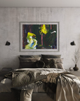 A framed abstract painting with bold yellow, green, and blue brushstrokes hangs on a textured light gray wall above a bed in a modern, stylishly decorated bedroom. The room features a hanging egg chair, a full-length floor mirror, and a large window looking out onto a scenic landscape.