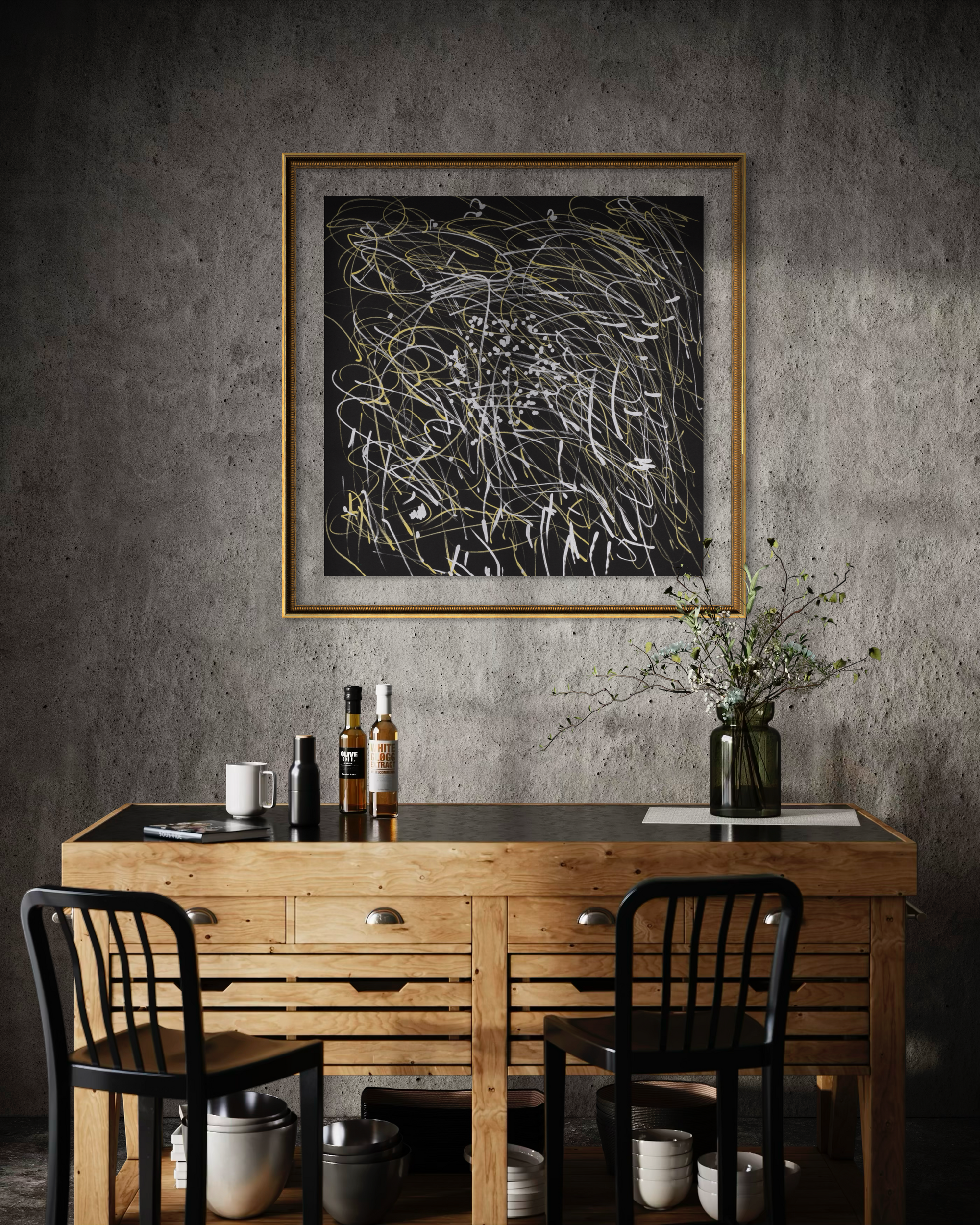 A framed abstract black-and-white artwork with gold lines hangs on a textured gray wall above a wooden console table with two black chairs, bottles, and a vase in a moody interior setting.