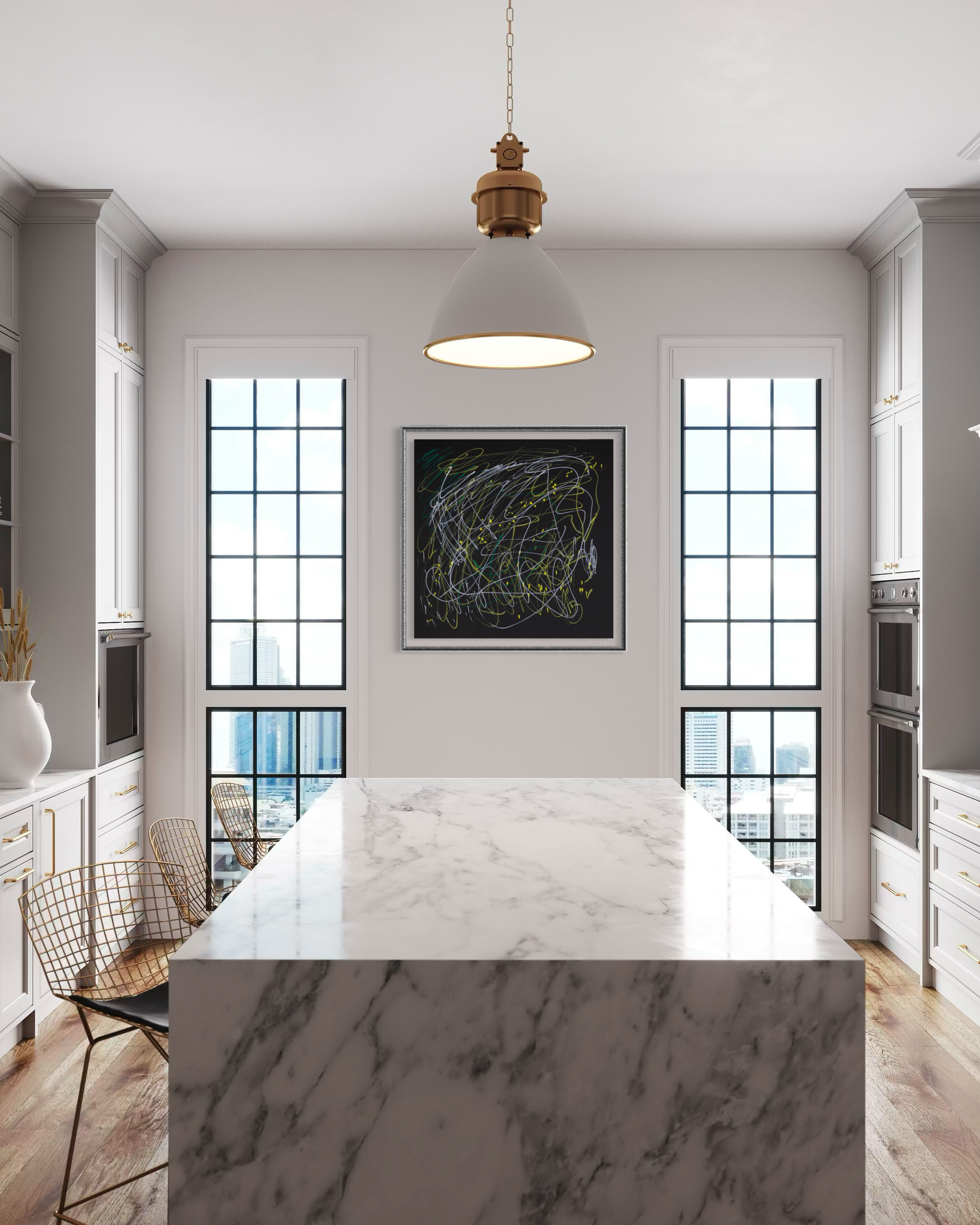A modern kitchen interior with a large white marble island in the foreground, white cabinetry, wood floors, and a black framed abstract artwork centered between two tall windows.